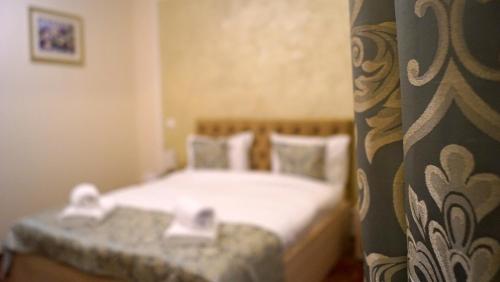 Postel nebo postele na pokoji v ubytování Pensiunea Romeo Resort