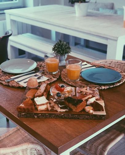 a table with a plate of food on a table at La Fuentona de Santillana in Vispieres