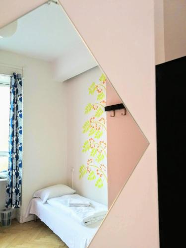 a bedroom with a bed and a mirror at Sleep in Heaven in Copenhagen
