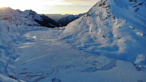 an aerial view of a snow covered mountain at Hotel Bernina Hospiz in Berninahäuser