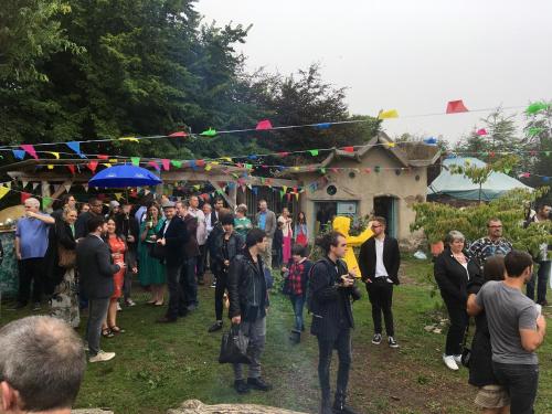 a crowd of people standing in front of a market at Inch Hideaway Eco Camping in Whitegate