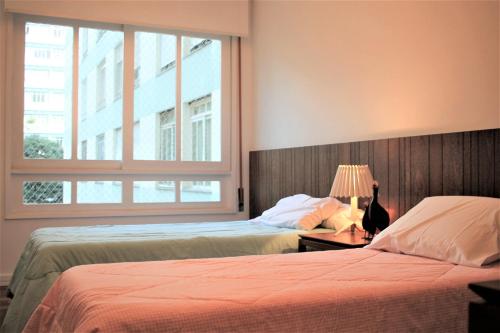 A bed or beds in a room at Design e sofisticação em Higienópolis