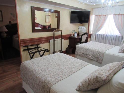 Hotel Ciudad de Vitoriaにあるベッド
