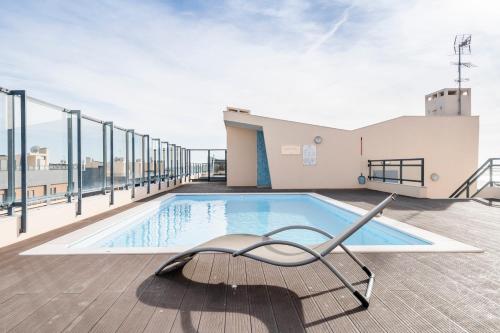 a swimming pool on the roof of a building at OCEANFRONT: Luxury Spectacular Sea Views and Pool in Olhão