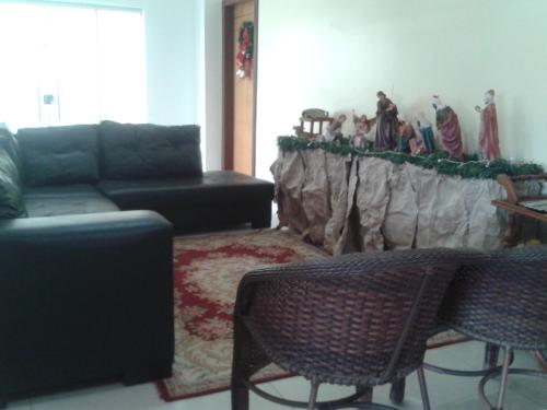 a living room with a couch and a table at Rillos Hotel in Altamira