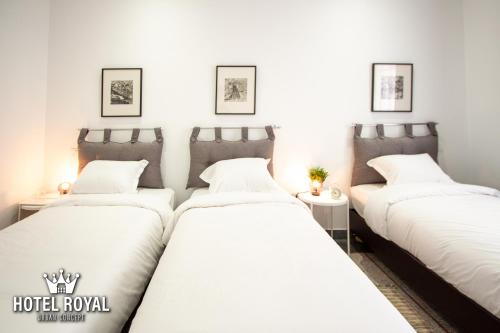 Postel nebo postele na pokoji v ubytování Hôtel Royal Urban Concept