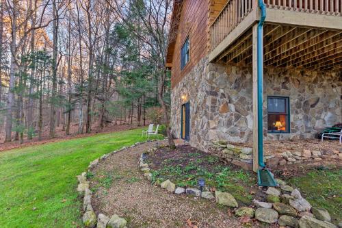 a stone building with a porch and a yard at Quaint Apt about 5 Miles to Appalachian Trail and Lake! in Elizabethton