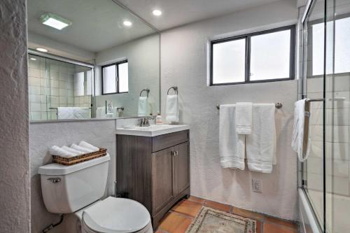 a bathroom with a toilet and a sink and a shower at Adobe House with Patio - Walk to Dtwn Plaza and Shops! in Santa Fe