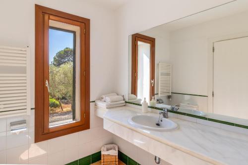 a bathroom with a sink and a mirror at Finca Son Blat in Porto Cristo