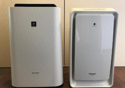 two electronic devices sitting next to each other on a table at Hotel Ascent Plaza Hamamatsu / Vacation STAY 64697 in Hamamatsu