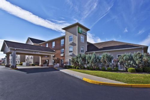 a hotel with a sign on the front of it at Holiday Inn Express Hotel & Suites Columbus Southeast Groveport by IHG in Groveport