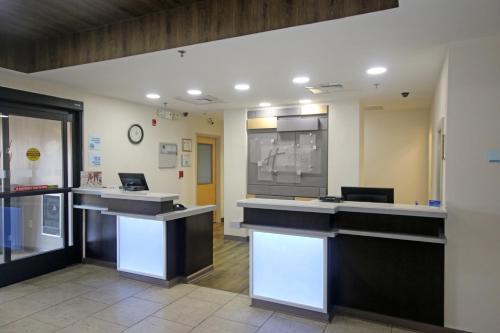a lobby of a hospital with a reception desk at Holiday Inn Express Hotel & Suites Greensboro-East by IHG in Greensboro
