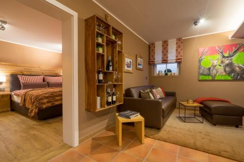 a living room with a bed and a couch at Große Wies in Oberstdorf