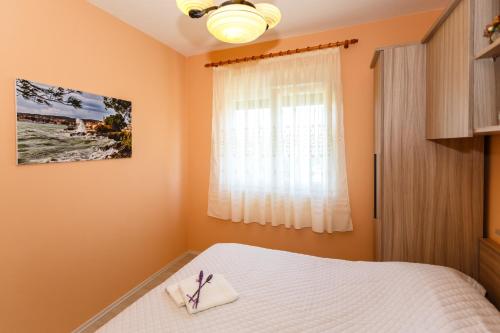 Katil atau katil-katil dalam bilik di Apartmani Vršek