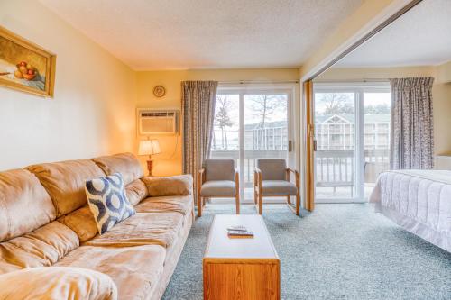 a living room with a couch and a table at Misty Harbor Resort in Gilford