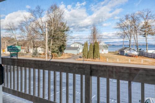 a view of the water from the balcony of a house at Misty Harbor Resort in Gilford