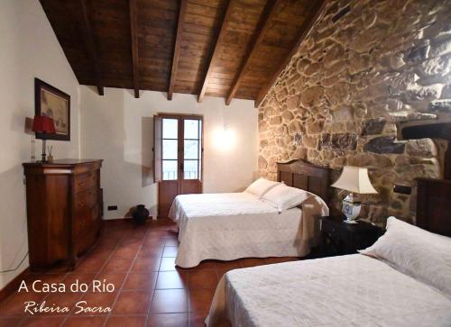 Posteľ alebo postele v izbe v ubytovaní A Casa do Río