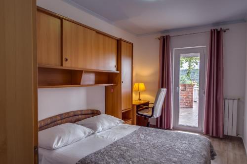 Katil atau katil-katil dalam bilik di Apartments Bajcic