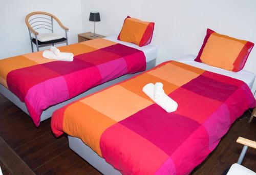 Un pat sau paturi într-o cameră la B&B L'Epicure