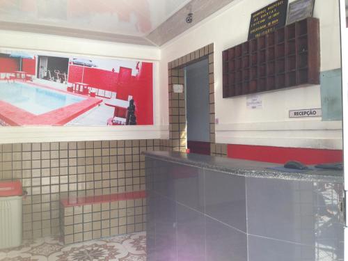 a pool room with a swimming pool in a building at Hotel Spada in Belém