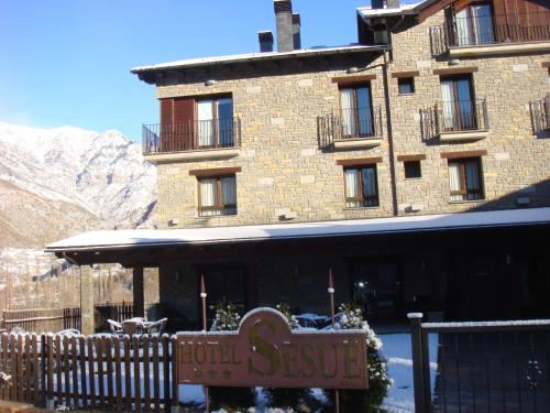 a hotel sign in front of a building at Hotel Sesué in Sesué