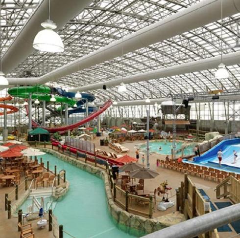 a large indoor water park with a swimming pool at The INN in Montgomery