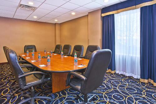 a conference room with a large table and chairs at Holiday Inn Express and Suites Pittsburgh West Mifflin by IHG in West Mifflin