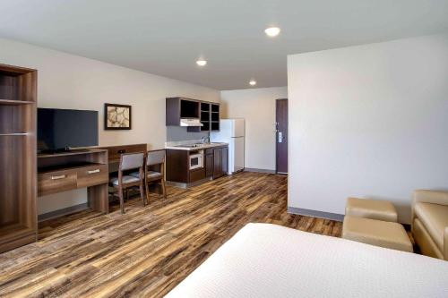 a room with a kitchen and a living room at WoodSpring Suites Baltimore White Marsh - Nottingham in White Marsh