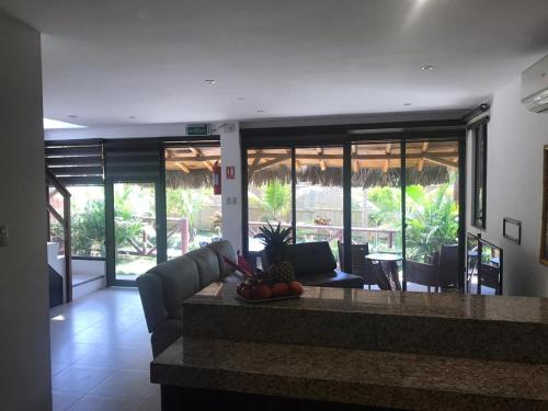 a living room with a couch and a table at The Heights in Montañita in Montañita