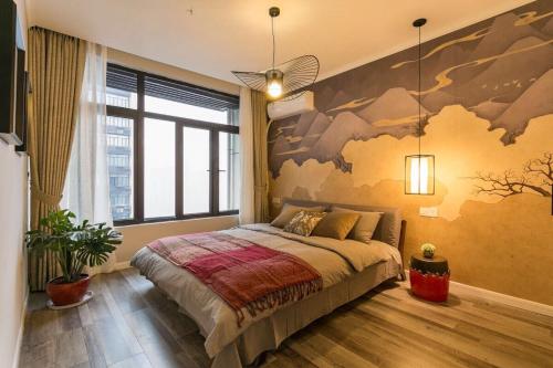 a bedroom with a bed with a large mural on the wall at Wuhan Wuchang·Happy Valley· Locals Apartment 00121930 in Wuhan