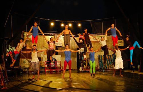 a group of people performing on a stage at Central Corner d'Angkor in Siem Reap