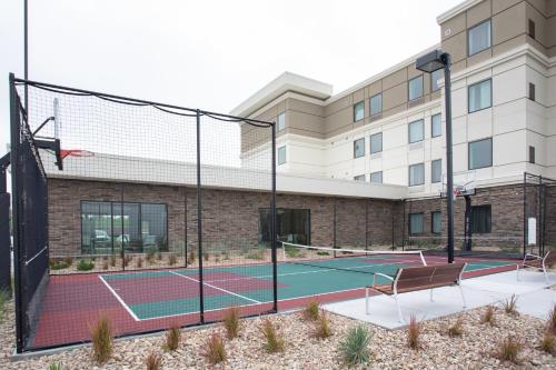 a tennis court in front of a building at Staybridge Suites Denver South - Highlands Ranch by IHG in Littleton