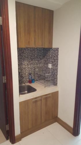 a kitchen with a sink and a counter top at Mataram City Apartment 700 Sadewa in Yogyakarta