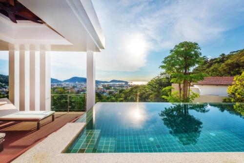a swimming pool in a villa with a view at Wyndham Sea Pearl Resort, Phuket in Patong Beach