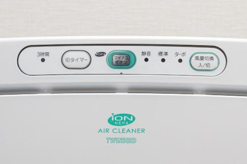 an oven with an air cleaner sign on it at Ostay Shin-Osaka Hotel Apartment in Osaka