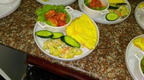 a table with plates of food on a counter at Dzveli Batumi in Batumi