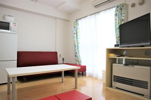 TV a/nebo společenská místnost v ubytování 801 新規オープン 50平米の広めのお部屋で快適空間 中島公園駅徒歩4分の好立地