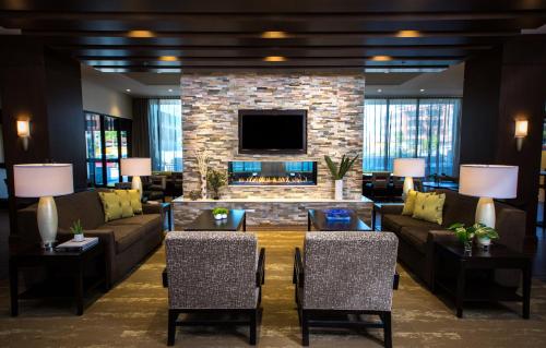 a living room with a couch and a fireplace at Staybridge Suites Seattle - South Lake Union by IHG in Seattle