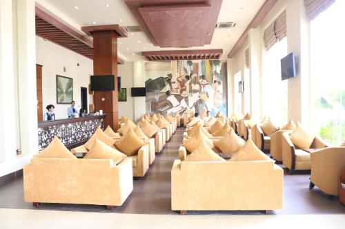 a row of chairs in a hotel lobby at Viet Uc Hotel in Ben Tre