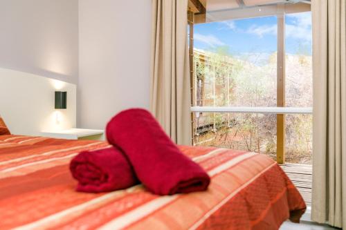 Ένα ή περισσότερα κρεβάτια σε δωμάτιο στο Erldunda Desert Oaks Resort
