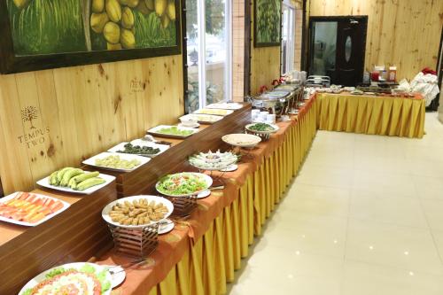 a buffet line with many plates of food at Viet Uc Hotel in Ben Tre