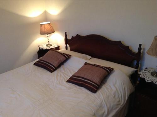 מיטה או מיטות בחדר ב-Rodini B&B