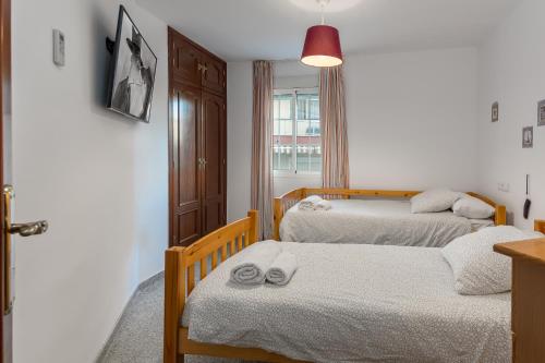 מיטה או מיטות בחדר ב-SF Carihuela Luxury Suite