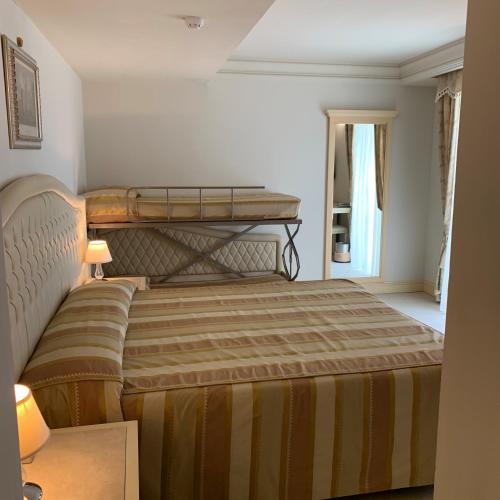 Cama ou camas em um quarto em Hotel Conchiglia