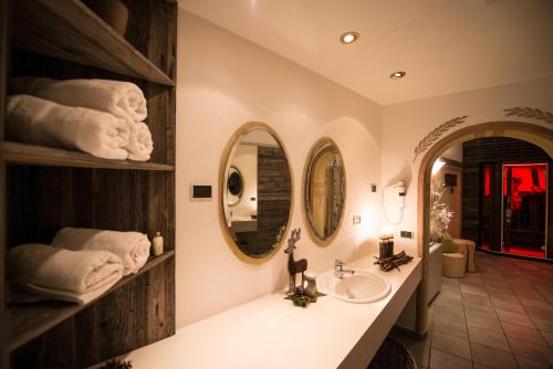 a bathroom with a sink and a mirror at Apparthotel Central in Campo Tures