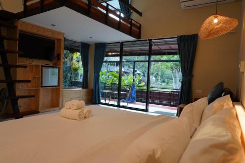 מיטה או מיטות בחדר ב-Villa Panalai