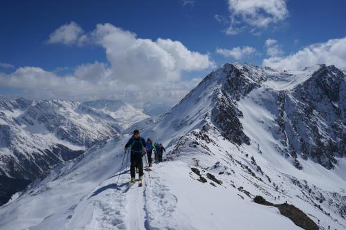 a group of people on skis on a snowy mountain at Almhotel Glieshof in Malles Venosta
