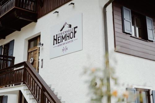 a sign on the side of a building at Ferienhaus Heimhof in Garmisch-Partenkirchen