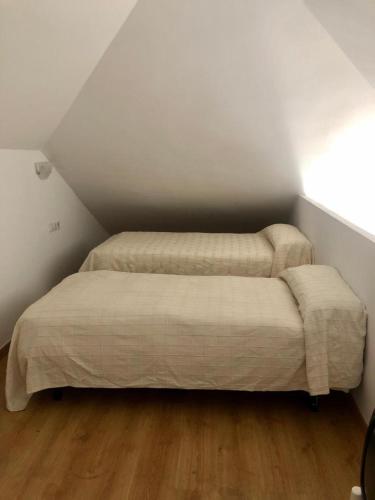 Una cama o camas en una habitación de GLP Sierra nevada