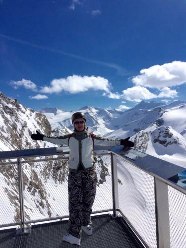 a woman standing on top of a snow covered mountain at Petra Maria Sölle - Ferienhaus sehr privat in Presseggersee